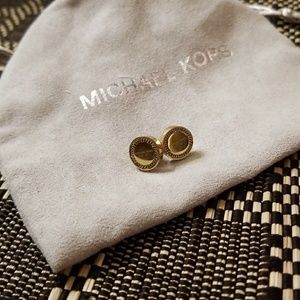 Michael Kors gold stud earing.
